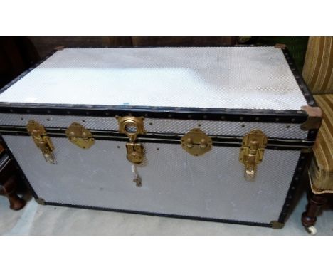 A metal covered school trunk