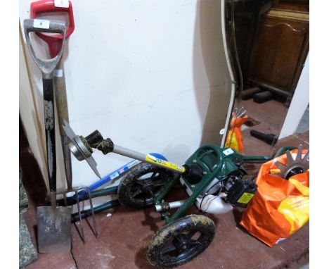 A petrol rotivator and a small quantity of tools. Ex House clearance