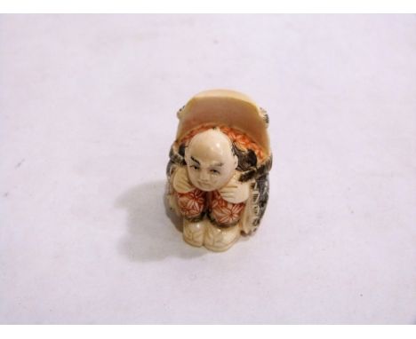 A Japanese carved ivory netsuke. 1¼''' high. Signed
