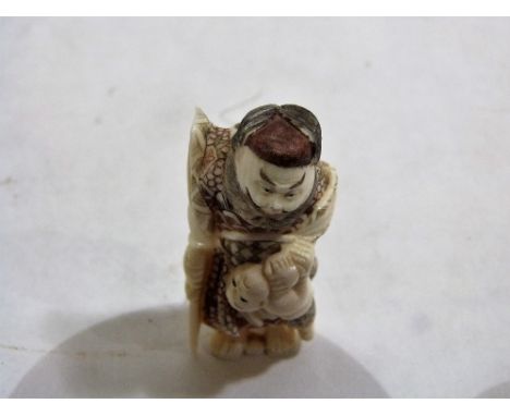 A Japanese carved ivory netsuke. Signed. 2'' high