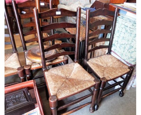 A set of four country ladder back chairs with rush seats, together with a lamp standard