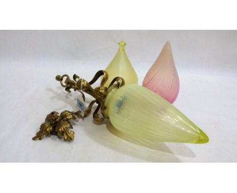 An Edwardian wrought brass hall lamp with vaseline glass tapered shade, 18'' high; together with a vaseline glass shade and a