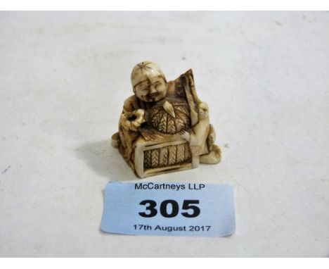A Japanese carved ivory netsuke. 1¼'' high