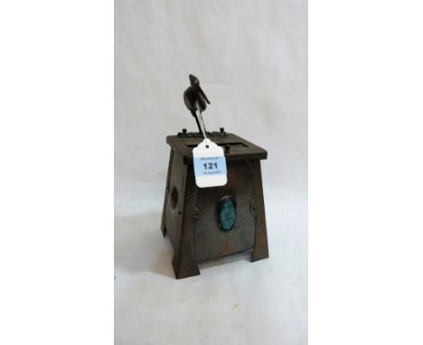 An Arts and Crafts anodised automaton cigarette dispenser, the front with inset Ruskin style plaque. 10'' high. C.1910  