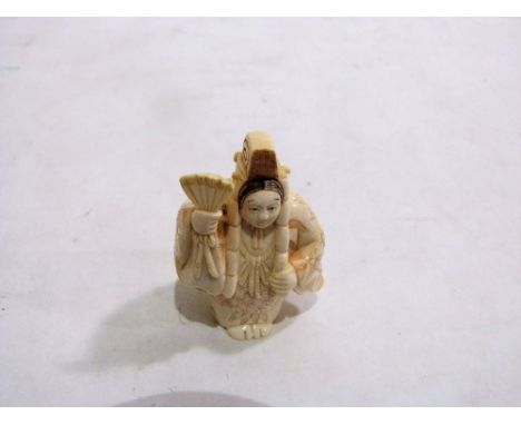 A Japanese carved ivory netsuke. Signed. 2'' high