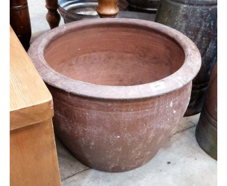 A terracotta garden planter. 21'' diameter