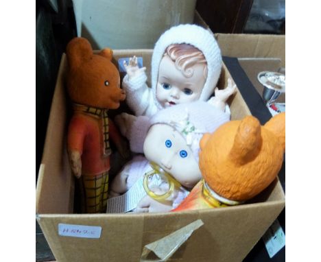 Two rubber Rupert Bear dolls, a Cabbage Patch doll and another