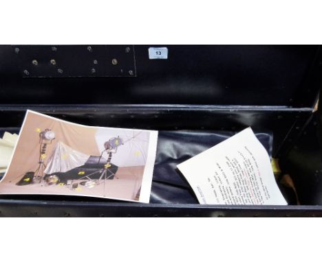 A studio lighting system and boxed photograph sleeves