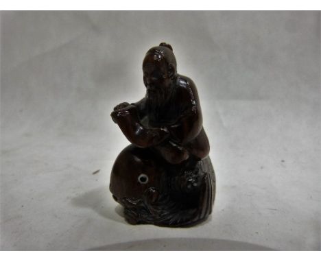 A Japanese carved ivory netsuke. Signed. 2'' high