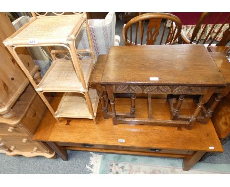 An oak nest of tables, oak occasional table and a wicker shelf unit (3). 