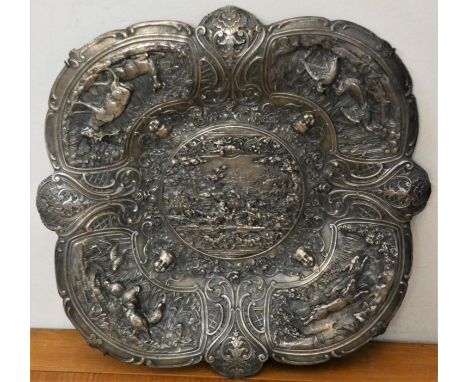 A 19th century electrotype wall plaque, unsigned, ornately decorated with hunting scene, bordered by deer, grouse, hares and 