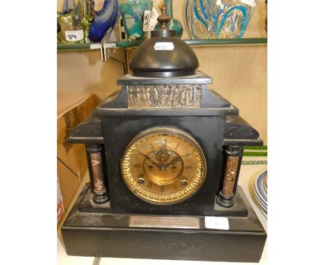 A Victorian black slate mantel clock, gilt face with black Roman numerals and dials, with silver presentation plaque presente