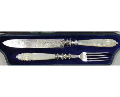 A Victorian silver plate and mother of pearl knife and fork, with fruit engraved decoration, carved handles, case. 