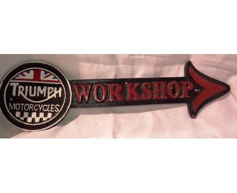 Cast iron Triumph workshop arrow, W: 35 cm. P&amp;P Group 1 (£14+VAT for the first lot and £1+VAT for subsequent lots) 