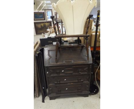 An oak fall front bureau in the 17th Century manner, together with a dark elm Ercol style hanging plate rack, a cane seated e