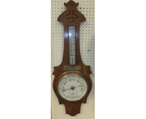 An oak cased aneroid barometer by Douglas, Stourbridge bears brass plaque inscribed "Presented to Mr E H Billingham by the Vi