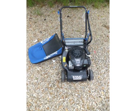A MacAllister petrol driven lawn mower with powered drive, with Briggs & Stratton 500E Series 140cc engine and a table saw an