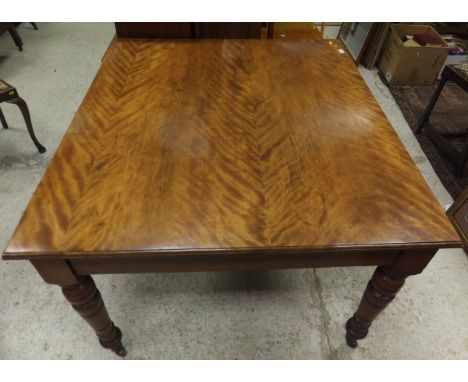 A Victorian satin walnut table, the plain top on turned legs to castors, together with a floral tapestry upholstered long sto