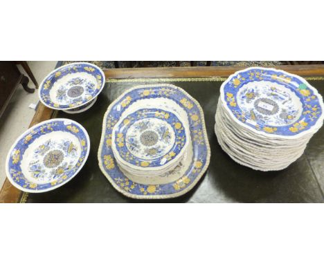 A collection of 19th Century Spode pottery dinner wares with clobbered transfer decoration in the Oriental taste, depicting s