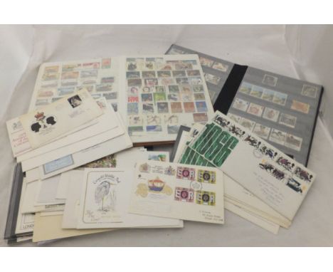 A box containing assorted late 20th Century first day covers, together with various stamp albums containing stamps