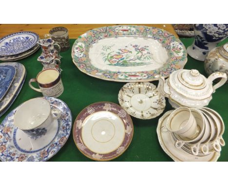 A large 19th Century pottery turkey platter with draining well decorated in "Indian Curl" pattern, together with a pair of 19