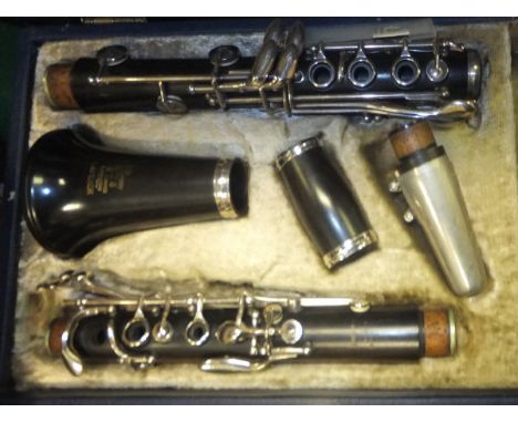 A Boosey & Hawkes London "Emperor" clarinet, housed in a blue carrying case, together with an early 20th Century Singer minia