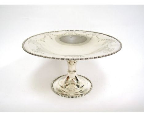 A silver Atkin Brother comport dish with engraved swag decoration, bobbin turned edge, Sheffield 1920, 14.2cm tall, 26cm diam