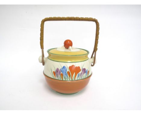 A Clarice Cliff Crocus pattern biscuit barrel and cover with woven handle 