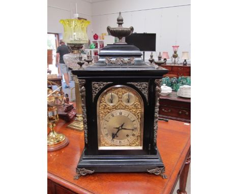 A late 19th Century Winterholder &amp; Hofmeier ebonised case bracket clock with urn form finials, mask column adornments. Th