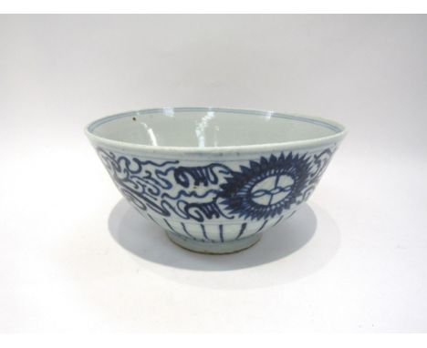 A Chinese Swatow ware export bowl, painted with stylised chrysanthemums, the interior with a foliate spray, seal mark to the 