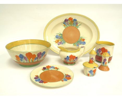 Eight pieces of Clarice Cliff Crocus pattern pottery including fruit bowl, oval platter, salt and pepperette, mustard jug, si
