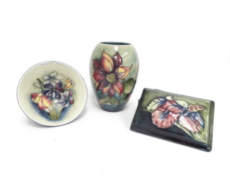 Three pieces of Moorcroft including Orchid pattern lidded trinket box, Clematis pattern vase 13m tall and Spring Flowers patt