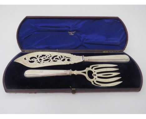 A Victorian cased silver fish knife and fork serving set, makers mark J G, Birmingham 1874, monogram to handle 