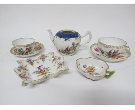 A Meissen teapot, damage present and two Dresden cups and saucers, pin dish and cup 