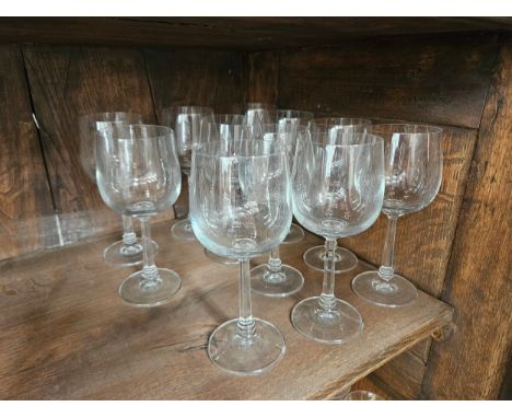 Eleven tall wine glasses with facet stem to ring turned base, 19cm tall 
