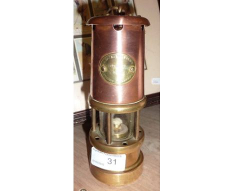 Small brass and copper miners lamp