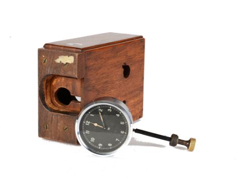  Motoring, a vintage automobile dashboard clock, with black 8cm dial, chrome bezel and Arabic numerals, with custom made  oak