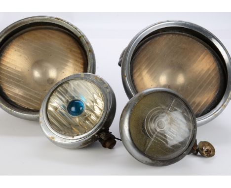 Motoring-Lamps, a pair of large Lucas headlamps with 26cm glass lenses in hinged bezels and cone chromed backs, with applied 