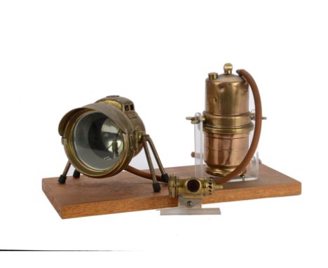  Motorcycle, A LUCAS  No 2 carbide Motor cycle lighting system, mounted on a board comprising, front main light, carbide tank