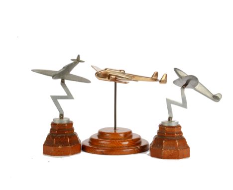 Aviation, a pair of vintage hand made aluminium Spitfire fighter planes mounted on wooden bases together with a larger brass 