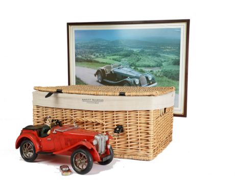 Motoring-MG, a resin model of a MG sports car in red approx. 42cm long together with a novelty car lighter a print of a Morga