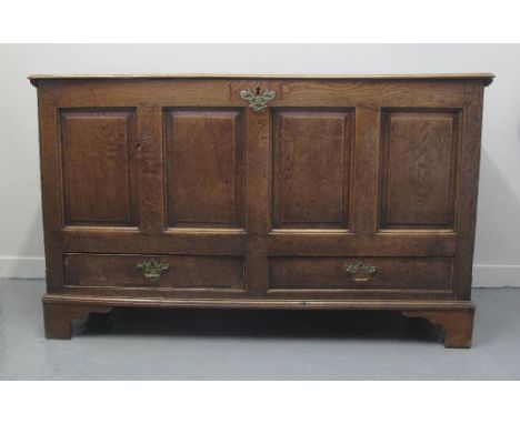 LATE 19TH/EARLY 19TH CENTURY OAK COFFER, having hinged plank top revealing candle box above four blind panels and two drawers