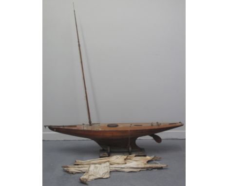 LARGE EARLY 20TH CENTURY WOODEN POND YACHT 'THE IPOH', labelled: '18 footer S.M.Y.C.'.  The hull of planked construction and 