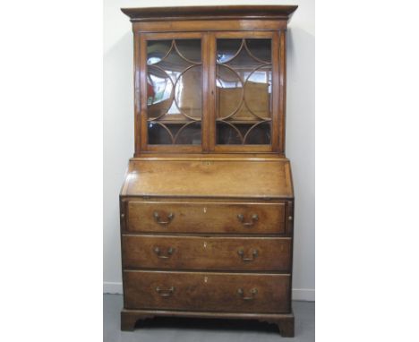 EARLY 19TH CENTURY WELSH OAK BUREAU BOOKCASE, having glazed door top with moulded cornice over two doors with curved glazing 