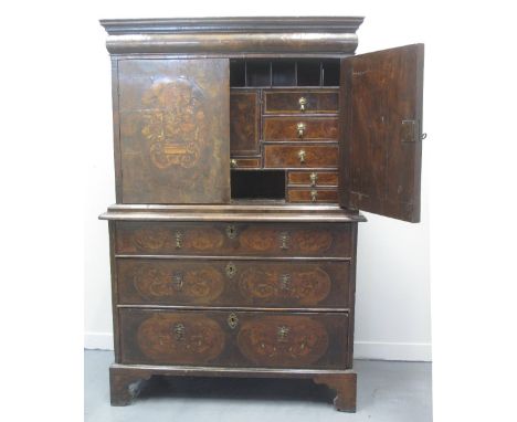 18TH CENTURY WALNUT MARQUETRY INLAID TWO STAGE CABINET ON CHEST, having moulded cornice over blind cushion drawer, two blind 