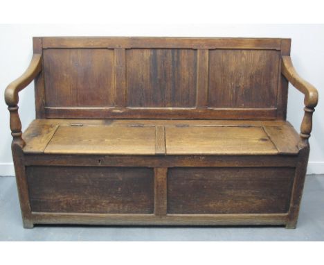 LATE 19TH CENTURY PEMBROKESHIRE PINE SETTLE, having three panelled back with scrolled open arms on baluster turned supports, 