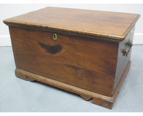 EARLY 19TH CENTURY WELSH OAK COFFWR BACH, having moulded edge, fixed hinge top revealing candle box to the interior, plain si