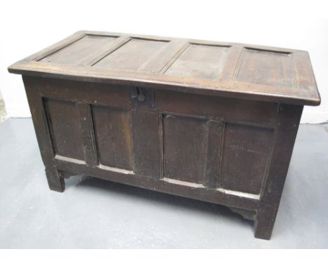 18TH CENTURY OAK FOUR PANEL COFFER, the panelled lid on later hinges, original iron lock plate but missing lock, on stile fee