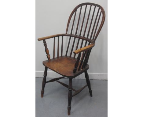 19TH CENTURY ASH AND BEECH FIRESIDE STICK BACKED ELBOW CHAIR, having baluster turned supports to the arms, moulded seat and b