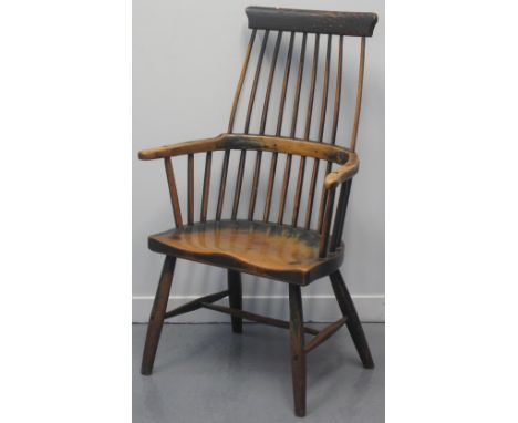 19TH CENTURY PRIMITIVE, COMB BACKED, FIRESIDE ELBOW CHAIR, principally constructed in ash and sycamore, and bearing some trac